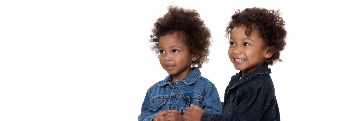 Two young sisters smiling