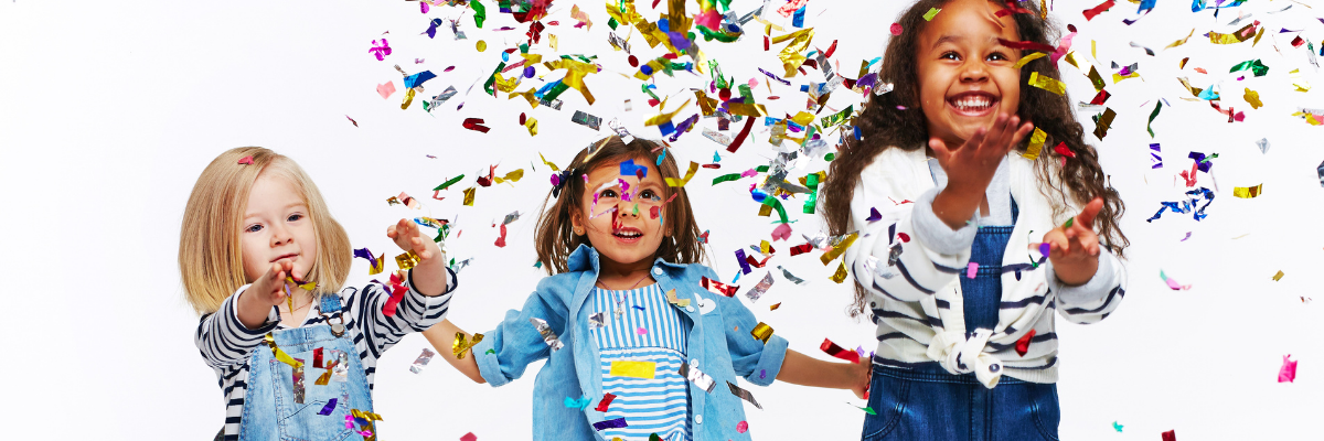 Small children celebrating in confetti