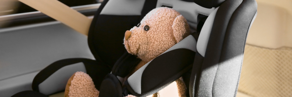 Teddy bear in a child's car seat