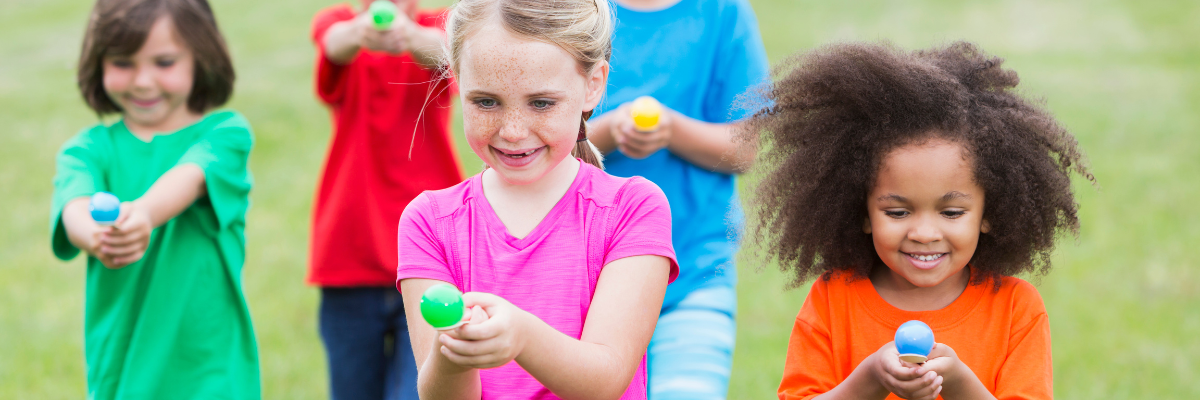 Primary school girls in an egg and spoon race